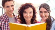 Students-Reading-At-The-Library-Books-Smiling-Friends